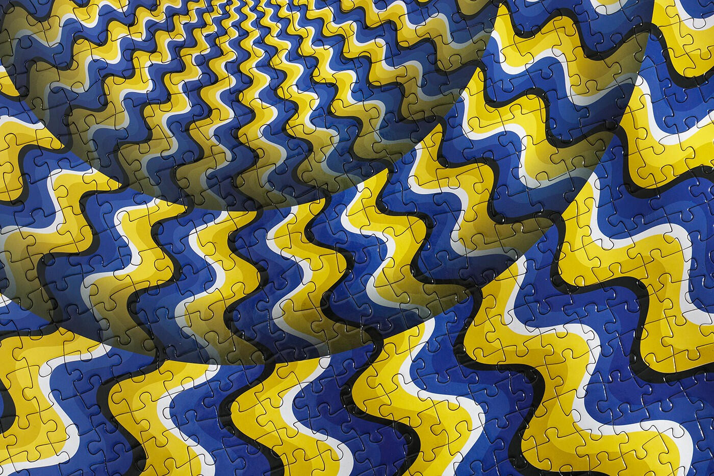 Puzzle that doubles a s an optical illusion when assembled