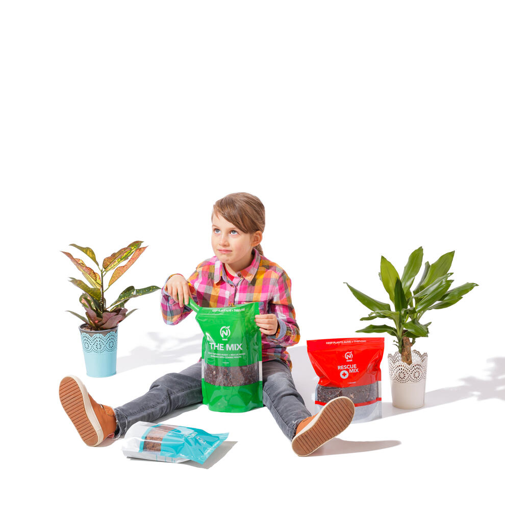 Child model on white background with plants