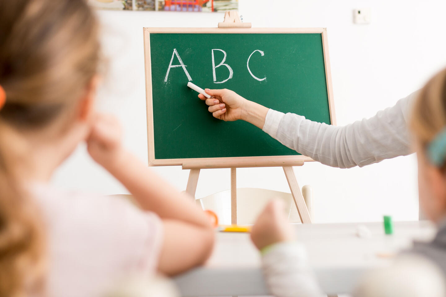 Hands on a school board teaching