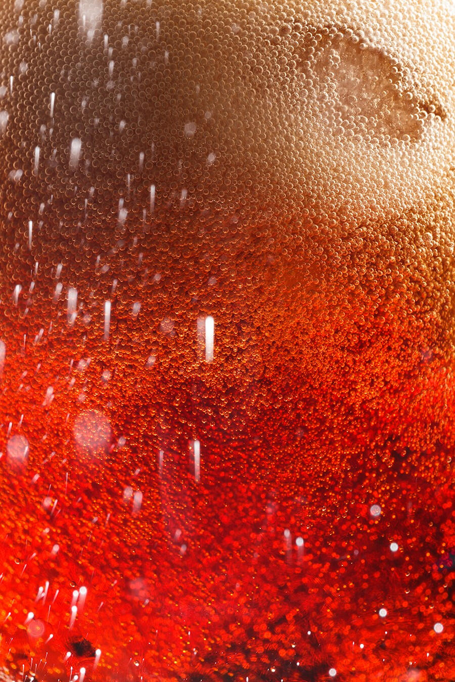 Macro shot of red fizzy drink bubbles