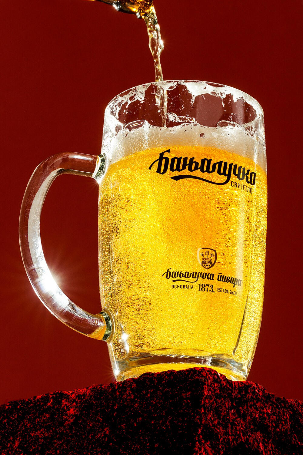 Macro hero shot a Kronenbourg beer glass