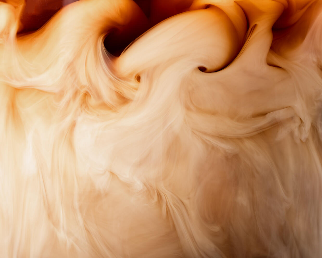 Macro image of coffee and milk mixture