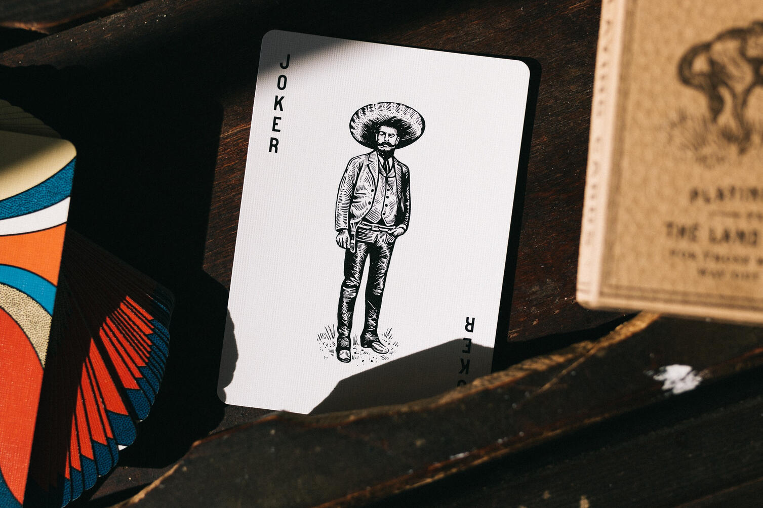 Image of a joker playing cards from a cowboy retro set Image of a joker playing cards from a cowboy retro set