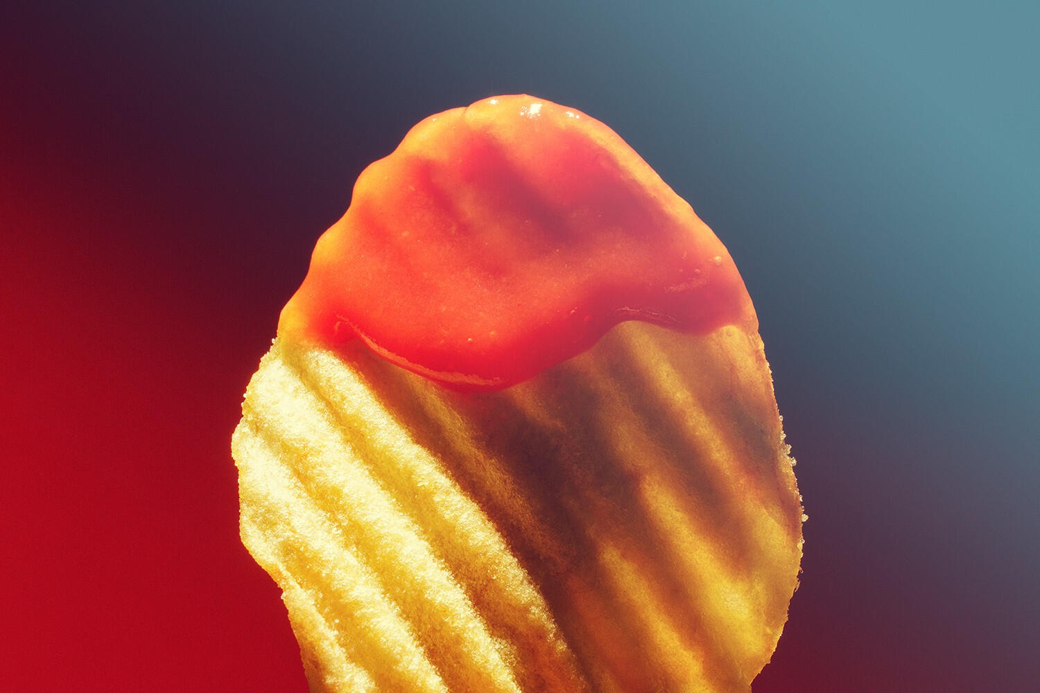 Retro macro shot of crinkled chips with ketchup